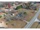 Aerial view of house and property showing large yard, detached buildings and surrounding neighborhood at 1349 Highway 81 E, Mcdonough, GA 30252