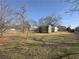 Spacious backyard featuring well-kept sheds and a grassy lawn at 1349 Highway 81 E, Mcdonough, GA 30252