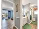 Bathroom view from an adjacent room, showing the sink vanity, shower, and decorative accents at 1349 Highway 81 E, Mcdonough, GA 30252