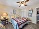 Bedroom with ceiling fan, wood-look floors and nice window lighting at 1349 Highway 81 E, Mcdonough, GA 30252