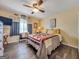 Cozy bedroom with a comfortable bed and ceiling fan at 1349 Highway 81 E, Mcdonough, GA 30252