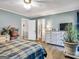 Bright bedroom with large windows, dresser, and ensuite bathroom at 1349 Highway 81 E, Mcdonough, GA 30252