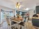 Bright dining area showcases views to the kitchen, decoratives, and abundant natural light from the bay window at 1349 Highway 81 E, Mcdonough, GA 30252