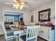 Cozy dining area with farmhouse table and view into the living room at 1349 Highway 81 E, Mcdonough, GA 30252