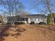 Charming single story home with well-kept front yard, mature tree, and covered front porch at 1349 Highway 81 E, Mcdonough, GA 30252