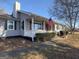 Inviting home with a cozy front porch, adorned with an American flag at 1349 Highway 81 E, Mcdonough, GA 30252