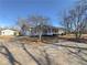 Well-manicured lawn and landscaping highlight this single-story home and shed at 1349 Highway 81 E, Mcdonough, GA 30252