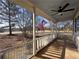 Cozy front porch featuring classic white railings and a view of the front yard at 1349 Highway 81 E, Mcdonough, GA 30252