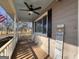 Covered porch with ceiling fan and American flag at 1349 Highway 81 E, Mcdonough, GA 30252