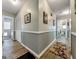 Clean hallway with light grey walls and wood-look flooring at 1349 Highway 81 E, Mcdonough, GA 30252