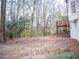 Spacious backyard with mature trees and deck at 1853 Edington Sw Rd, Marietta, GA 30064