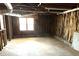 Unfinished basement with window and exposed utilities at 1853 Edington Sw Rd, Marietta, GA 30064