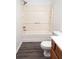 Bathroom with shower/tub combo and wood vanity at 1853 Edington Sw Rd, Marietta, GA 30064