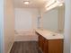 Bathroom with bathtub, double vanity, and mirror at 1853 Edington Sw Rd, Marietta, GA 30064