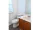 Bathroom with toilet, sink, and wood vanity at 1853 Edington Sw Rd, Marietta, GA 30064