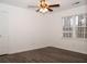 Bright bedroom with ceiling fan and wood-look flooring at 1853 Edington Sw Rd, Marietta, GA 30064