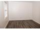 Simple bedroom with wood-look floors and window at 1853 Edington Sw Rd, Marietta, GA 30064