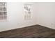 Well-lit bedroom featuring wood-look floors at 1853 Edington Sw Rd, Marietta, GA 30064