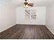 Spacious bedroom with ceiling fan and wood-look floors at 1853 Edington Sw Rd, Marietta, GA 30064