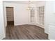 Bright dining area with wood-look floors and large windows at 1853 Edington Sw Rd, Marietta, GA 30064