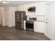 Stainless steel appliances and white cabinets in this kitchen at 1853 Edington Sw Rd, Marietta, GA 30064