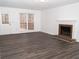 Living room with hardwood floors, fireplace, and deck access at 1853 Edington Sw Rd, Marietta, GA 30064