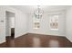 Bright dining room with hardwood floors and elegant chandelier at 2397 Foley Park St, Snellville, GA 30078