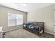 Bright bedroom featuring a daybed and large window at 686 Westmoreland Ln, Lawrenceville, GA 30043