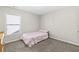 Cozy bedroom with a full-size bed and window at 686 Westmoreland Ln, Lawrenceville, GA 30043