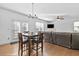 Dining area with hardwood floors and a view of the Gathering room and kitchen at 686 Westmoreland Ln, Lawrenceville, GA 30043