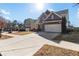 Two-story house with a large driveway and landscaped yard at 686 Westmoreland Ln, Lawrenceville, GA 30043