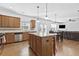 Open concept kitchen with island, stainless steel appliances, and hardwood floors at 686 Westmoreland Ln, Lawrenceville, GA 30043