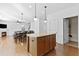 Kitchen island with granite countertop and seating for four at 686 Westmoreland Ln, Lawrenceville, GA 30043