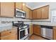 Kitchen with stainless steel appliances and granite countertops at 686 Westmoreland Ln, Lawrenceville, GA 30043