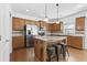 Kitchen with light wood cabinets, granite countertops and stainless steel appliances at 686 Westmoreland Ln, Lawrenceville, GA 30043