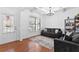 Living room with hardwood floors, coffered ceiling, and comfy sofas at 686 Westmoreland Ln, Lawrenceville, GA 30043