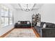 Living room with hardwood floors, coffered ceiling, and comfy sofas at 686 Westmoreland Ln, Lawrenceville, GA 30043