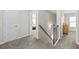 Upstairs hallway with carpet, leading to bedrooms and bathroom at 686 Westmoreland Ln, Lawrenceville, GA 30043