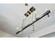 Modern linear chandelier with sleek metal and wood accents at 2626 Peachtree Nw Rd # 1804, Atlanta, GA 30305