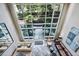 High-ceilinged lobby with seating area and courtyard view at 2626 Peachtree Nw Rd # 1804, Atlanta, GA 30305