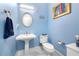 Small powder room with pedestal sink and toilet at 3280 Stillhouse Se Ln # 410, Atlanta, GA 30339