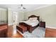 Spacious bedroom with hardwood floors and en-suite bathroom access at 3280 Stillhouse Se Ln # 410, Atlanta, GA 30339