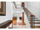 Two-story entryway with hardwood floors, and elegant staircase at 3280 Stillhouse Se Ln # 410, Atlanta, GA 30339