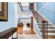 Two-story entryway with hardwood floors and staircase at 3280 Stillhouse Se Ln # 410, Atlanta, GA 30339