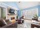 Living room with fireplace, hardwood floors, and access to patio at 3280 Stillhouse Se Ln # 410, Atlanta, GA 30339