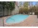 Community pool with brick patio and ample seating at 3280 Stillhouse Se Ln # 410, Atlanta, GA 30339