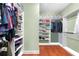 Spacious walk-in closet with ample shelving and hanging space at 3280 Stillhouse Se Ln # 410, Atlanta, GA 30339