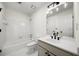 Simple bathroom with a tub, toilet, and vanity at 405 Ashdowne Way, Atlanta, GA 30350