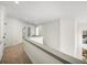 Bright hallway with carpeted floors and access to bedrooms at 405 Ashdowne Way, Atlanta, GA 30350