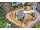 Aerial view of the new roof on a new construction home with neutral paint and new front yard at 4322 Timberland Sw Dr, Lilburn, GA 30047